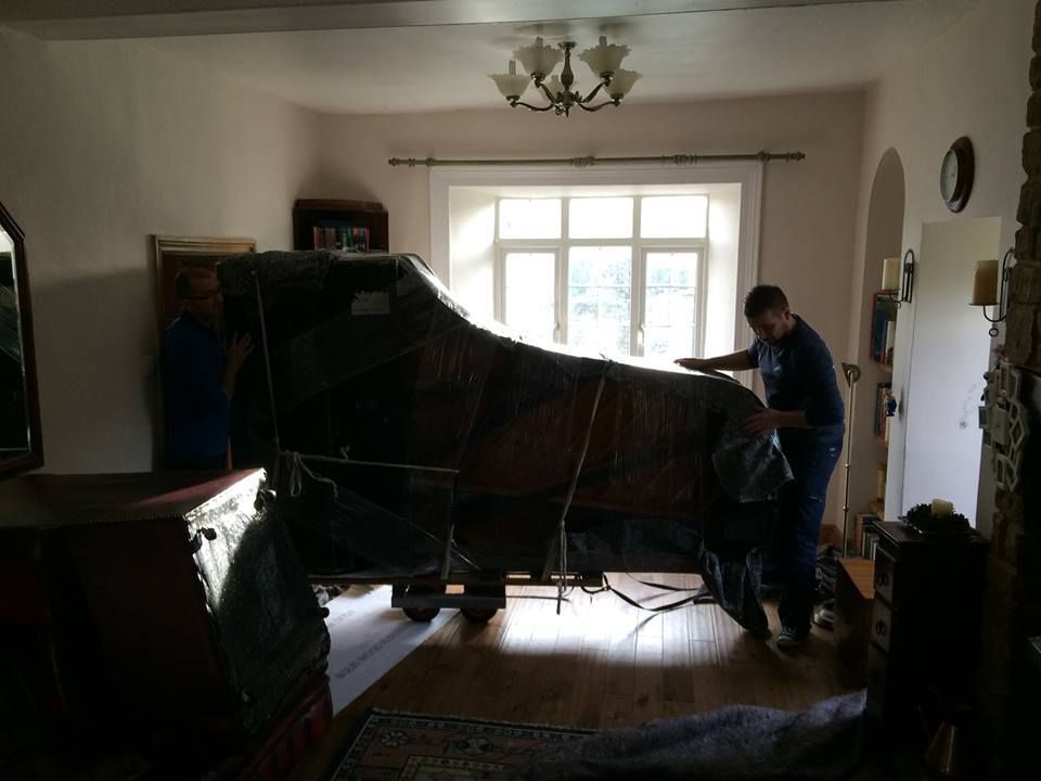 Baby grand piano moving